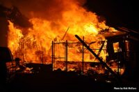 Remains of a building amid flames