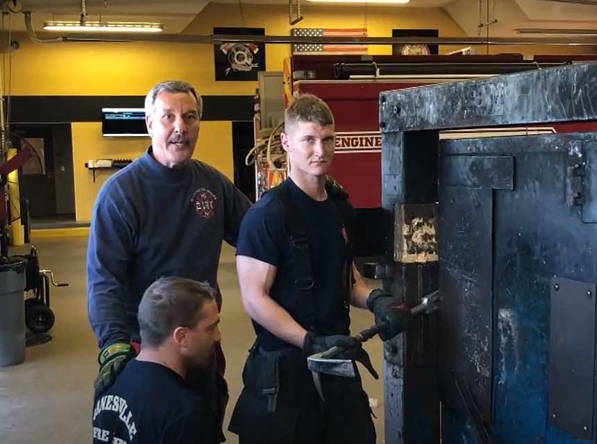 Mike Ciampo with firefighters working on a forcible entry prop