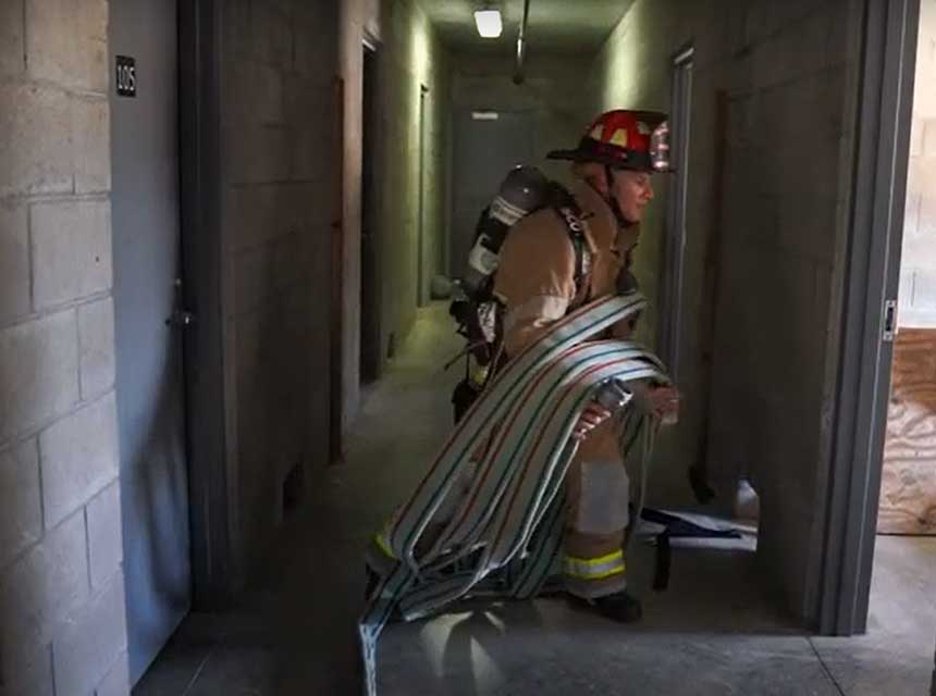 Miami-Dade Fire Captain demonstrates Cleveland/coil for standpipe operations