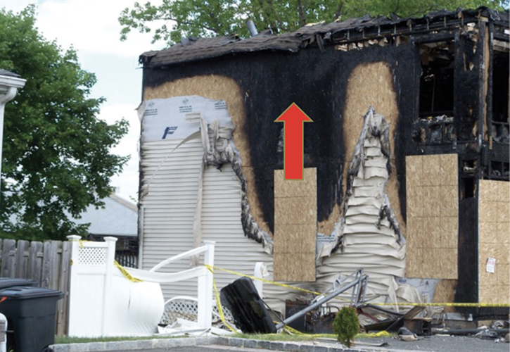 Rapid fire on the exterior of this structure resulted in the collapse and burning off of the roof.