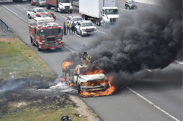 Firefighters responding to a vehicle fire