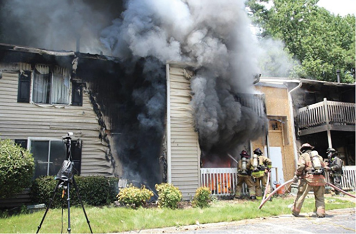 An initial exterior offensive attack with a solid or straight stream is versatile because it can attack exterior and interior fire effectively to rapidly gain fire control and improve conditions before crews advance to the interior.