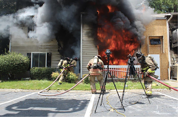 An initial exterior offensive attack with a solid or straight stream is versatile because it can attack exterior and interior fire effectively to rapidly gain fire control and improve conditions before crews advance to the interior.