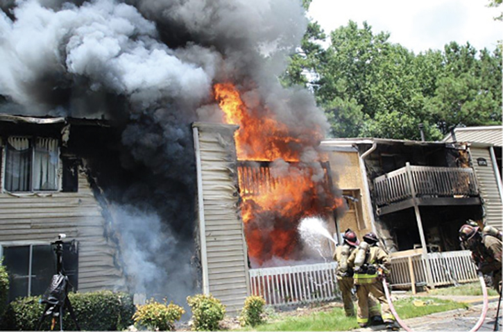 An initial exterior offensive attack with a solid or straight stream is versatile because it can attack exterior and interior fire effectively to rapidly gain fire control and improve conditions before crews advance to the interior.