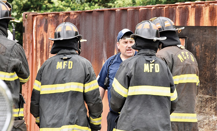 Fire instructor talking to firefighters