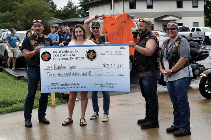 Recognition is important to all of us. Here, a member of the fire department receives funding for a university scholarship.