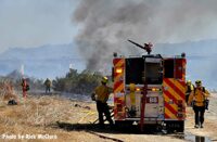 LAFD rig with smoke from vegetation fire in background