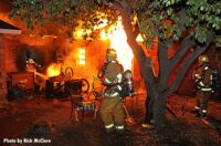 A firefighter framed by flames in Los Angeles