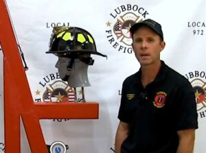 D Brady Robinette and firefighter helmet