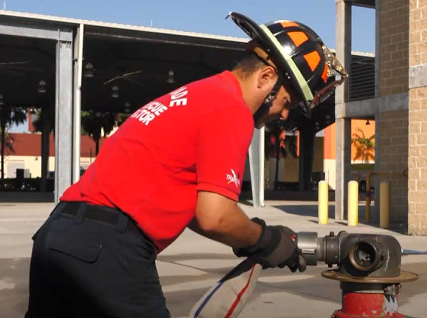 Firefighter attaching a hoseline to FDIC