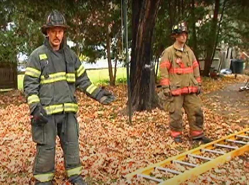 Mike Ciampo and another firefighter with a ground ladder