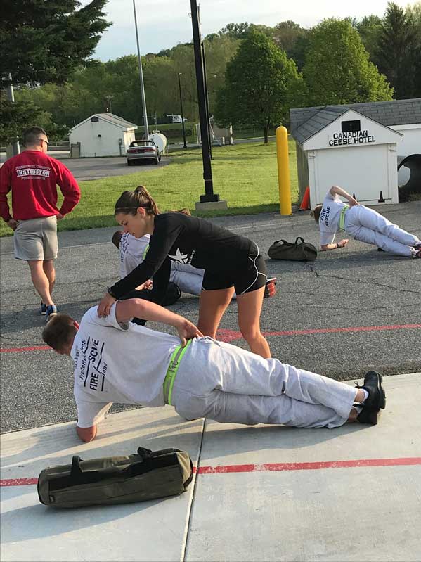 Kayla Schmit taking Recruit Class 28 through a prepare series.