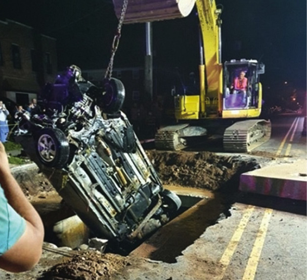 The vehicle was removed by heavy machinery overnight while an engine company staged with a line.