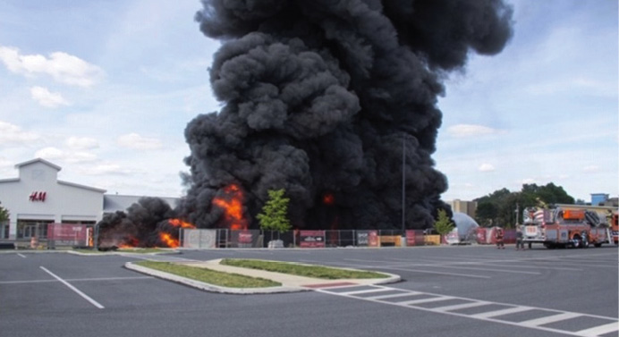 Huge black plume of smoke from drainage fire