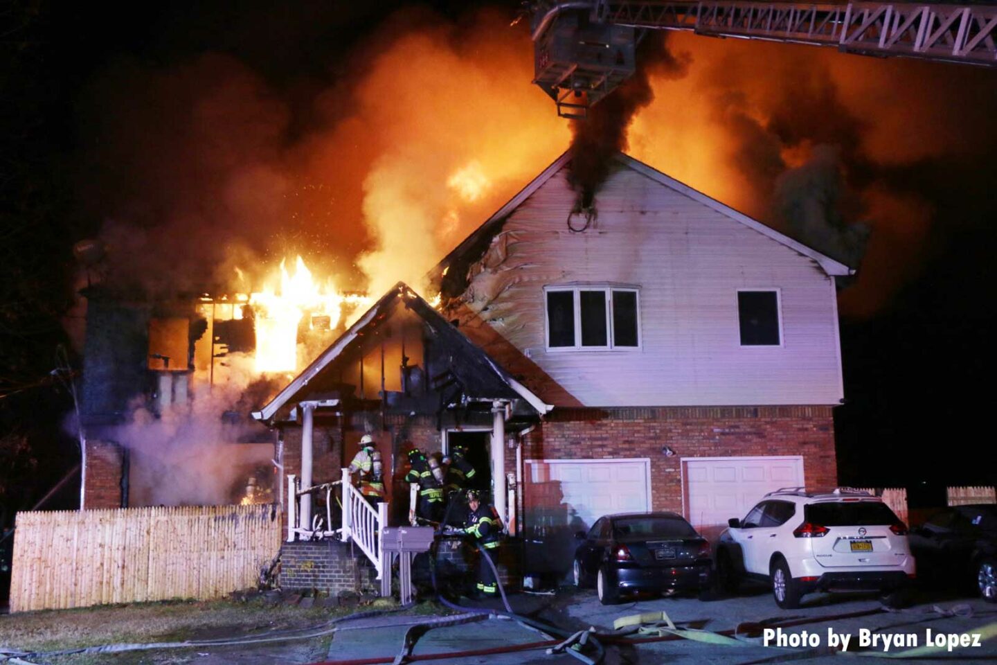 Flames shoot from a home on Long Island