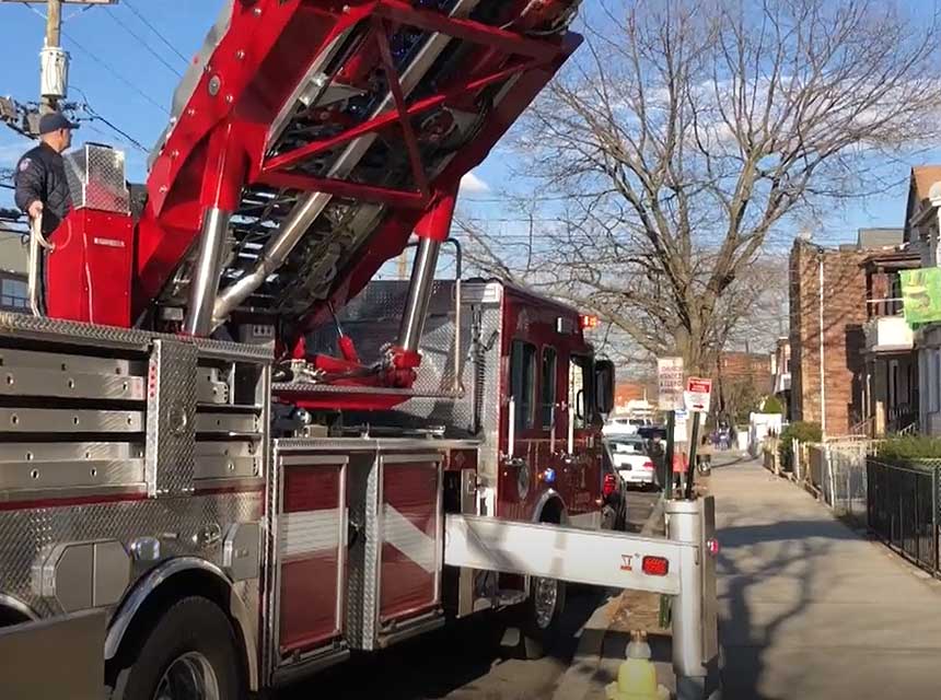 Tower ladder outriggers on a sidewalk