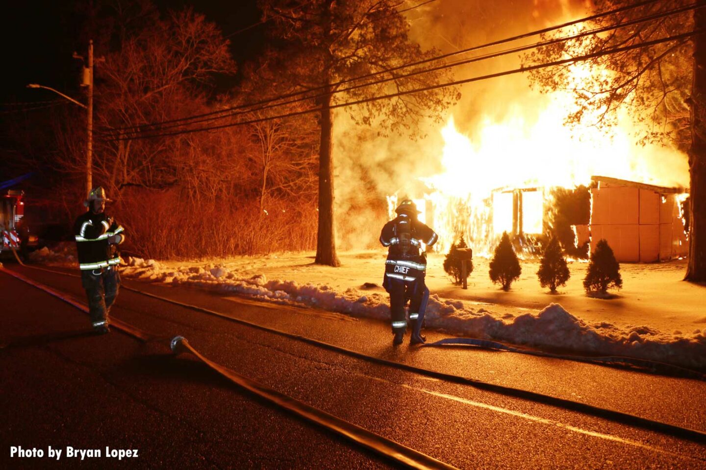 Firefighters begin to work at a fire in a vacant home