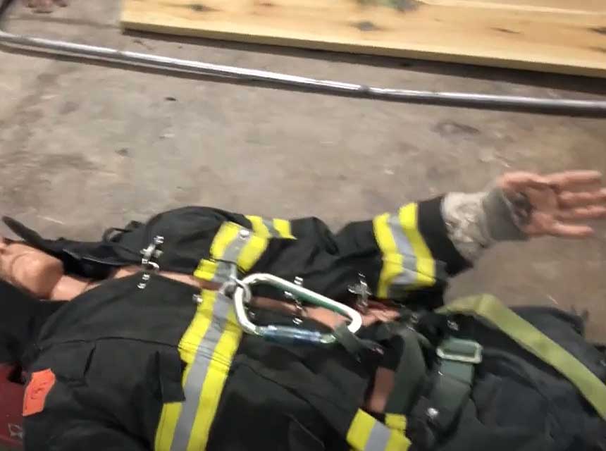 Dummy in firefighter gear with straps