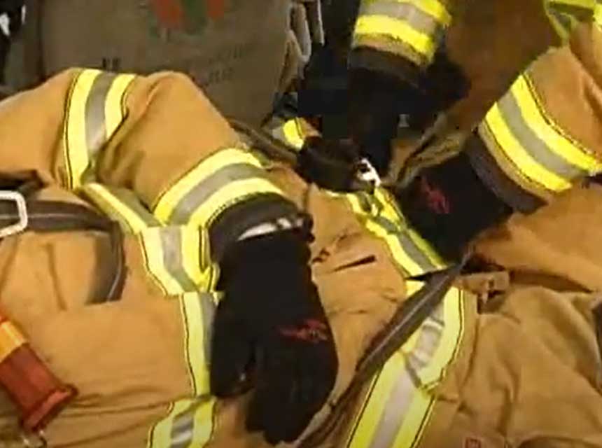 Use of personal harness on bunker gear to remove firefighter