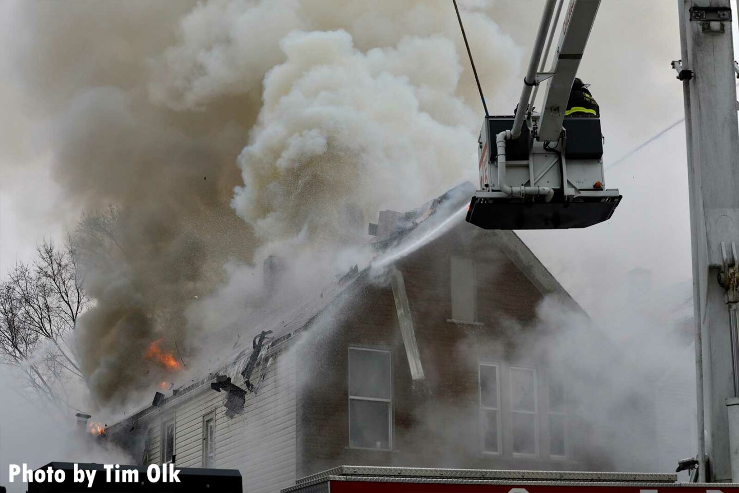 Chicago firefighters train a hose stream from a bucket