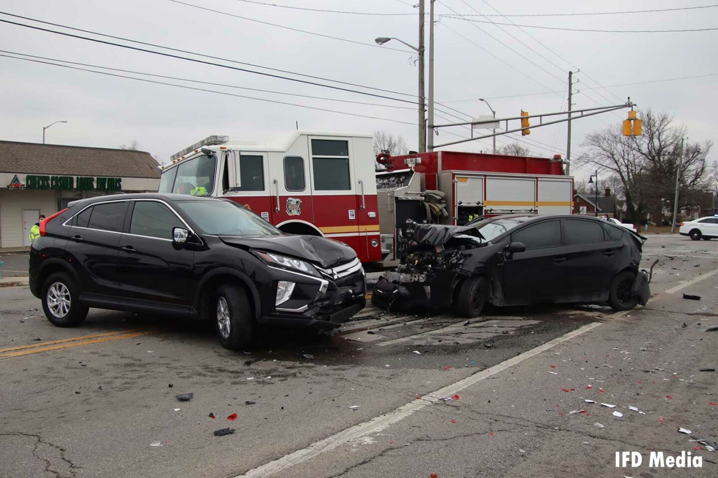 Two smashed vehicles after an accident involving an Indy fire truck