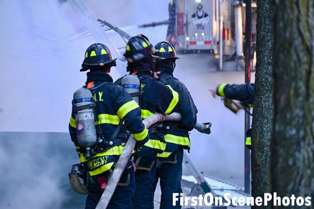 FDNY firefighters on a hoseline at three-alarm Bronx fire