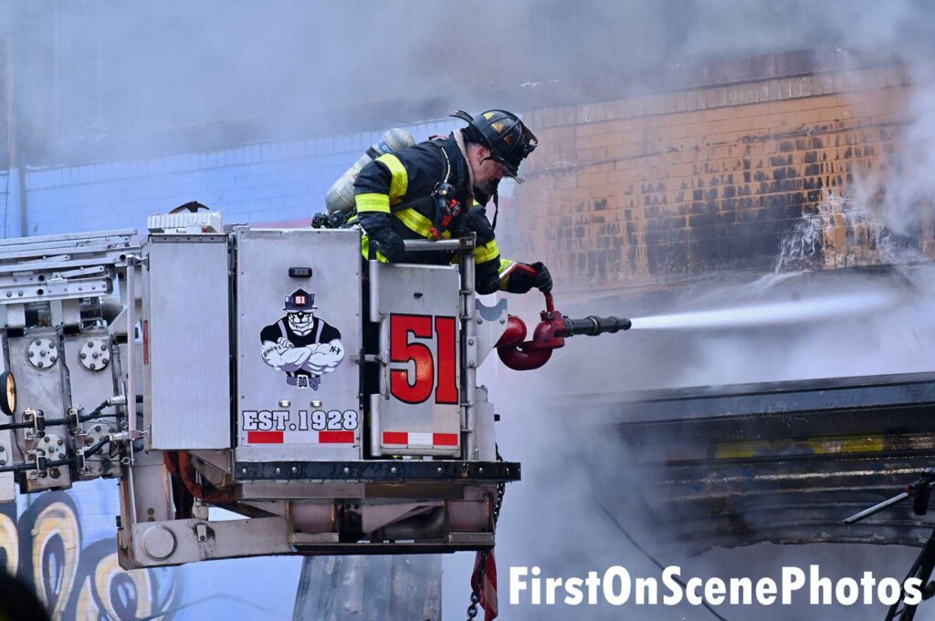 FDNY firefighter in a bucket at Bronx fire