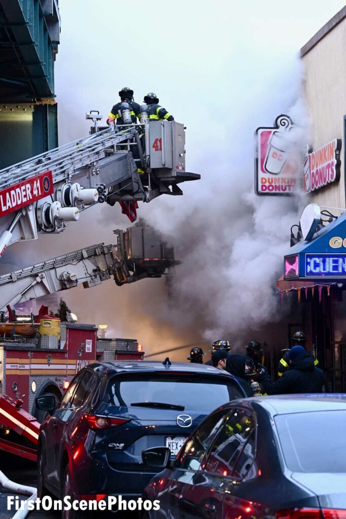 Multiple aerials in use as firefighters are enveloped in smoke from three-alarm Bronx fire