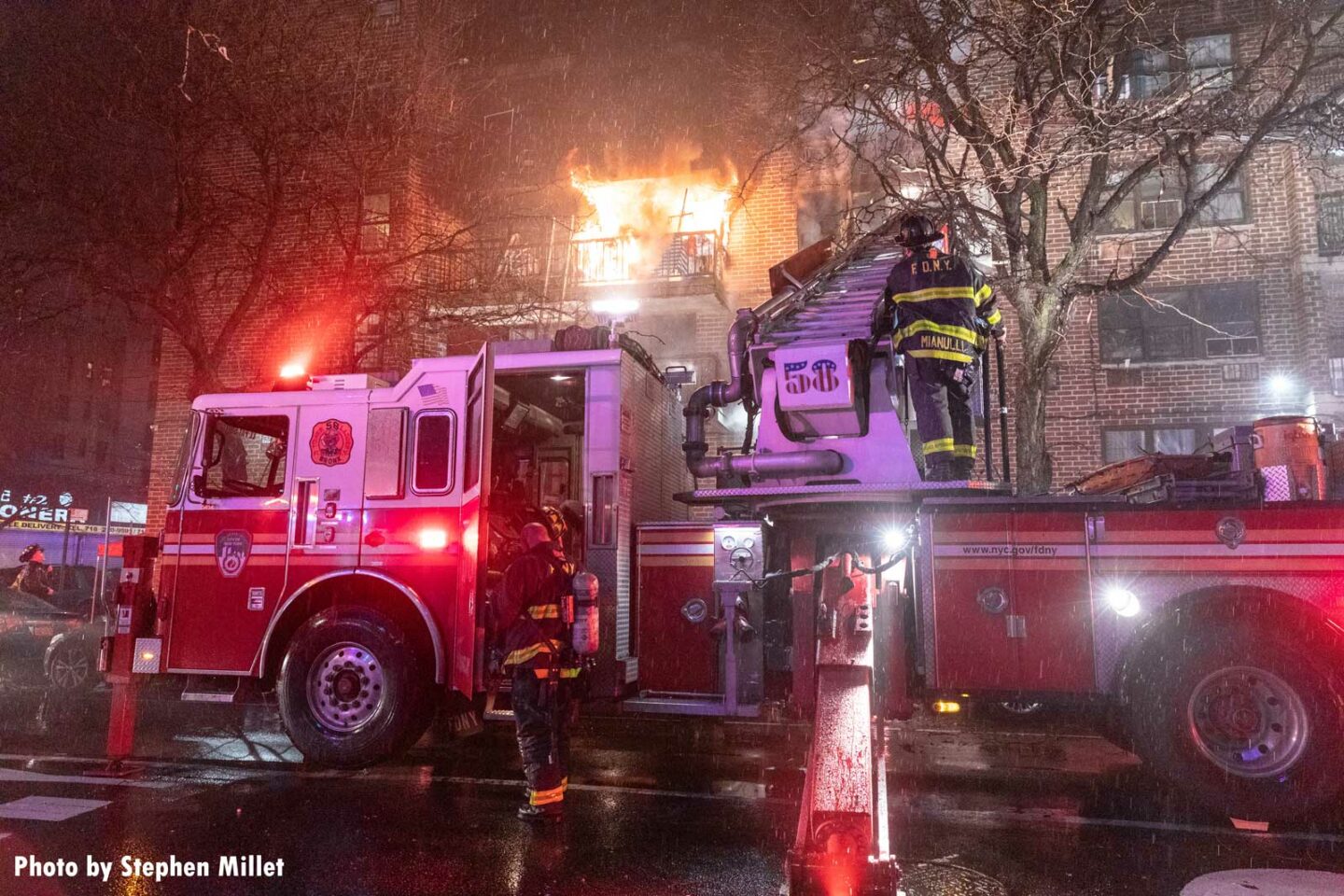 FDNY firefighter use an aerial device during a fire in the Bronx