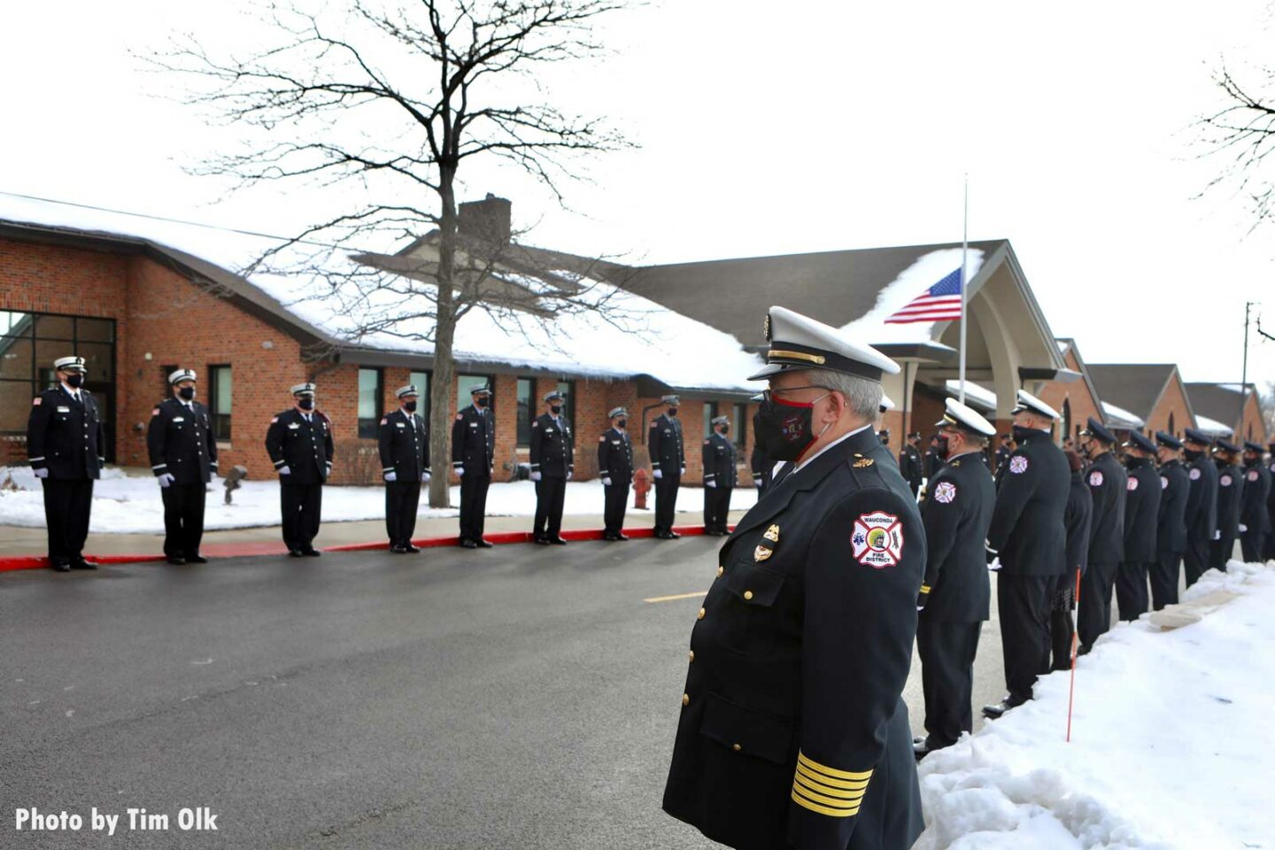 Firefighters line the roadway during Al Schlick funeral