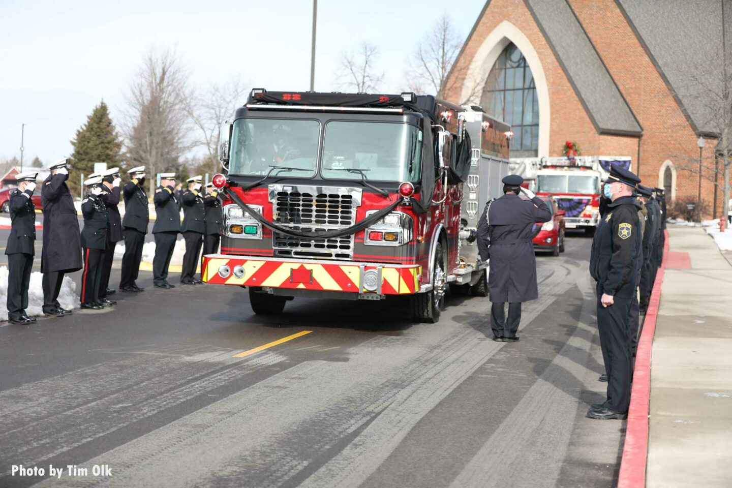 Firefighters salute rig at Al Schlick funeral