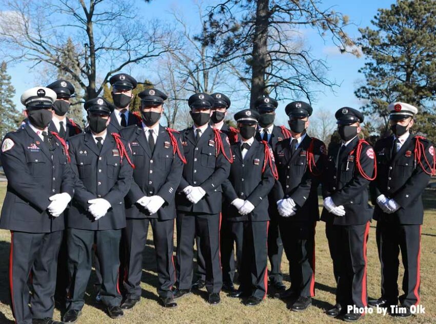 Chicago Fire Department members in masks at the funeral for Paramedic Robert Truevillian