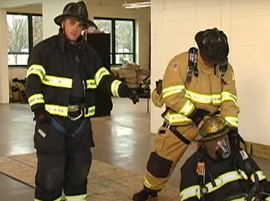 Dan DiRenzo and firefighter performing a rescue drag using firefighter PPE