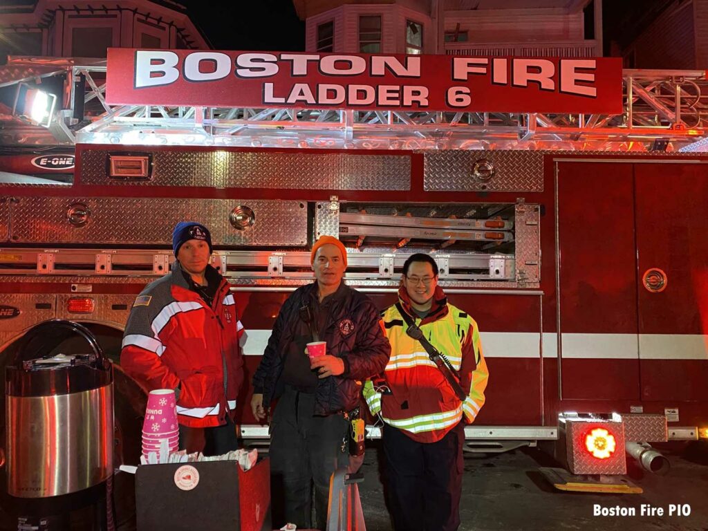 Rehab team in front of Boston Fire Ladder 6