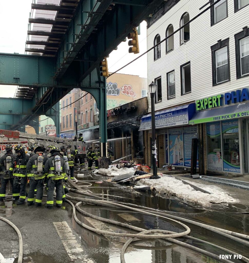 FDNY firefighters and hoselines at major Queens fire