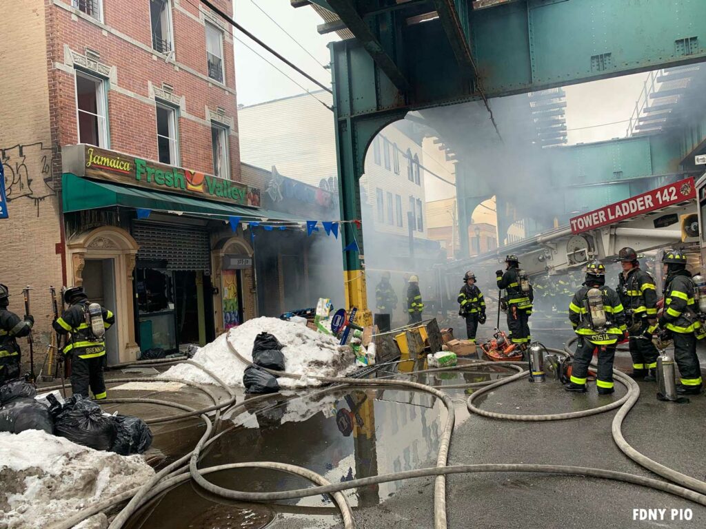 Tower Ladder 142 of FDNY with companies at five-alarm Queens fire