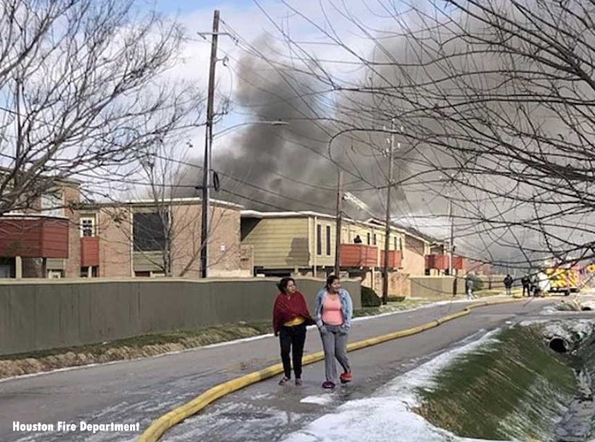 Smoke and flames rises from a multiple-alarm fire in Houston, Texas