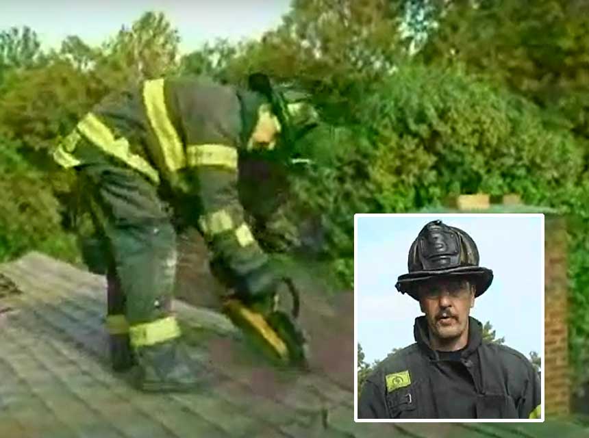 Mike Ciampo with a saw on the roof of a home