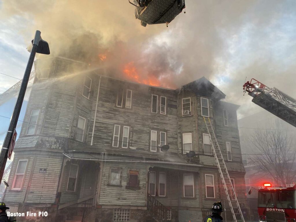 Flames rip through the building as Boston firefighters attack the fire from the exterior