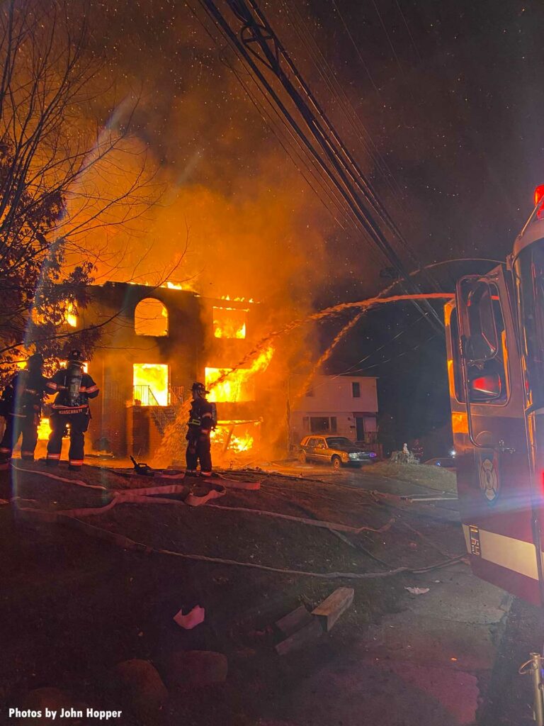 Firefighters put multiple hose streams on the exterior of a burning home in Yonkers, New York