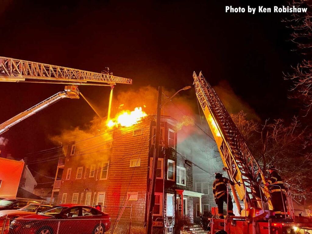 Elevated master streams from aerials and tower ladders at Lynn structure fire