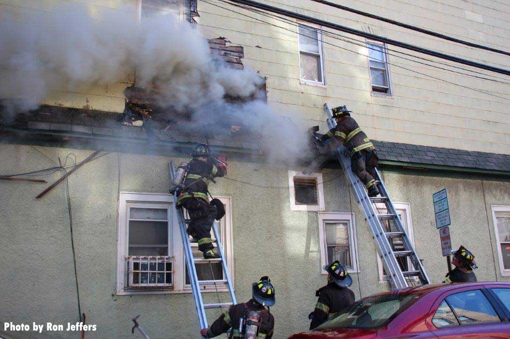 Firefighters on ladders at Union City fire