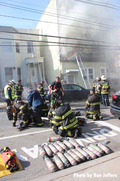 Firefighters and air cylinders at the scene of a Union City fire