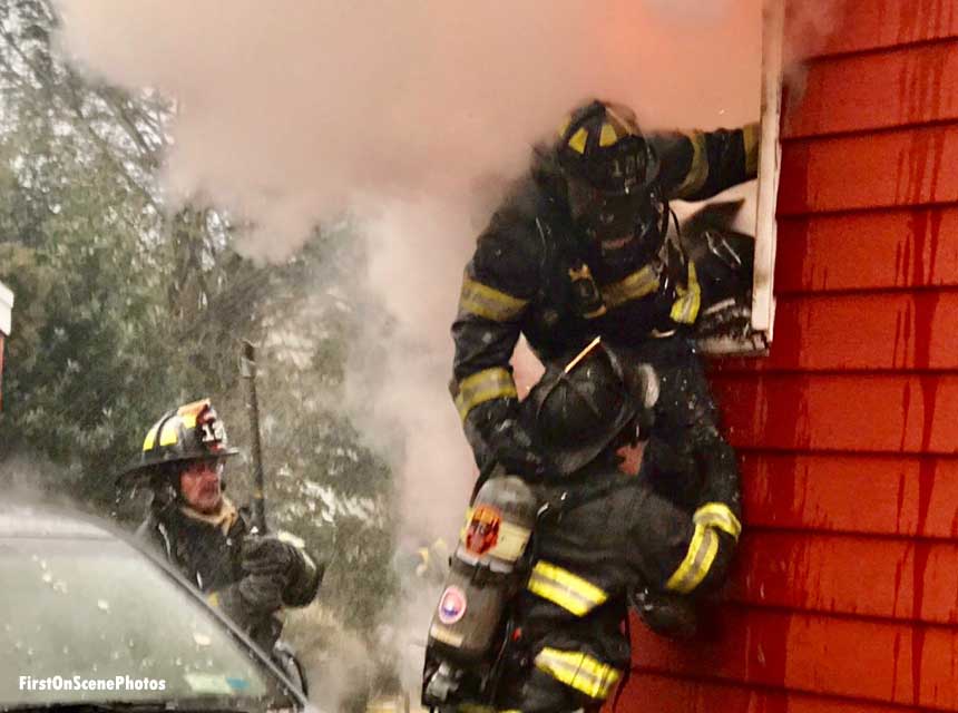 Firefighter emerges from window at Long Island house fire