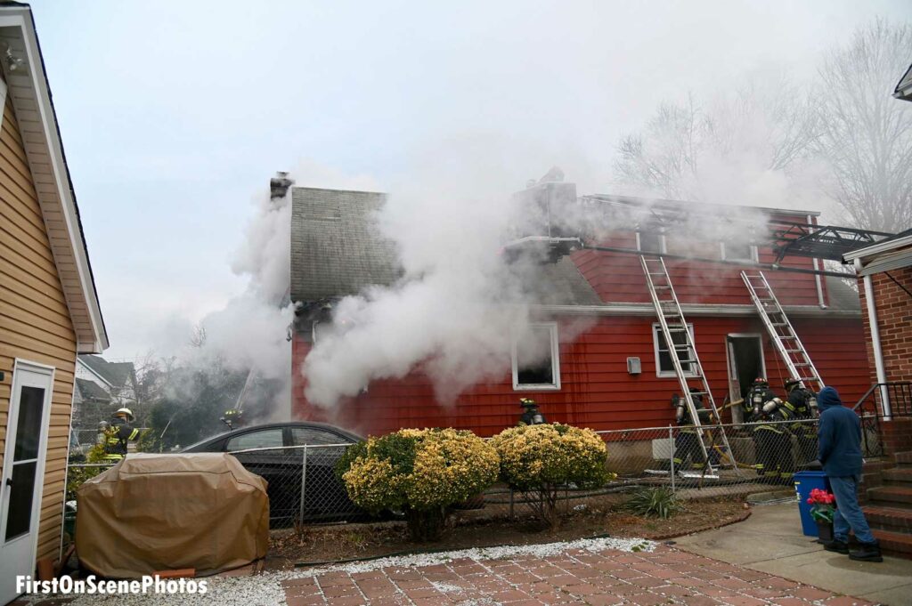 Flames and smoke shoot from a home on Long Island