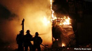 Firefighter framed by flames at Long Island house fire