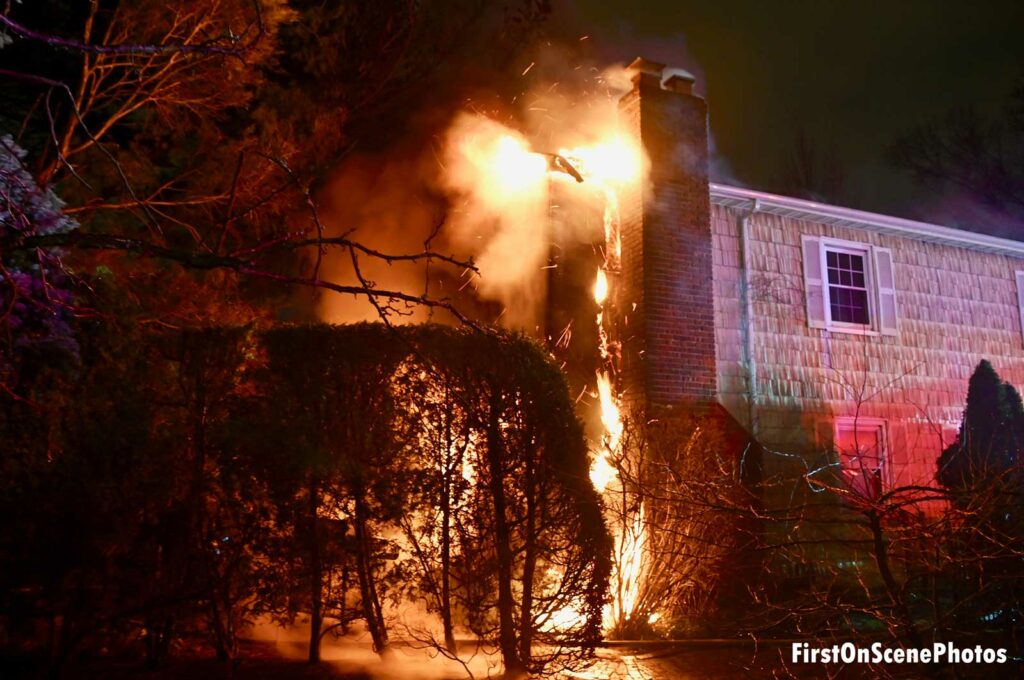 Another shot of fire ripping through the walls of the home