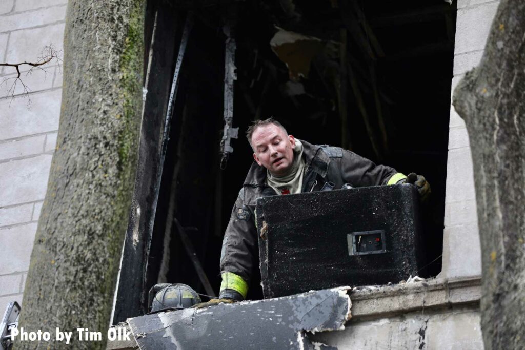 Firefighter puts his head out of a window at Chicago fire