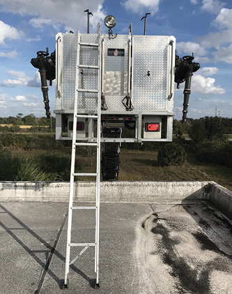 When encountering a high parapet, firefighters can deploy the folding ladder from a tower ladder bucket or off the tip of an aerial ladder for roof access.