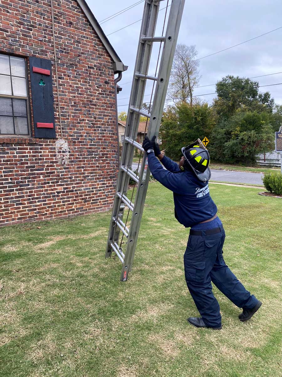 Firefighter training on a ground ladder